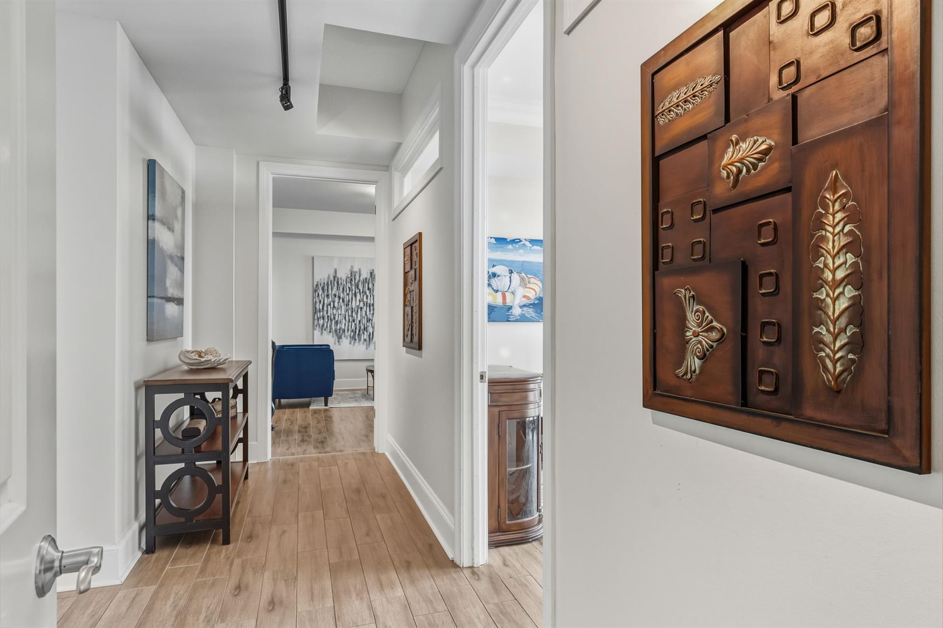 Bedroom 1 Hallway with Balcony Access and 2 Twin Beds on the Right