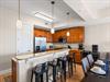 Kitchen provides a breakfast bar where you can enjoy morning coffee together.