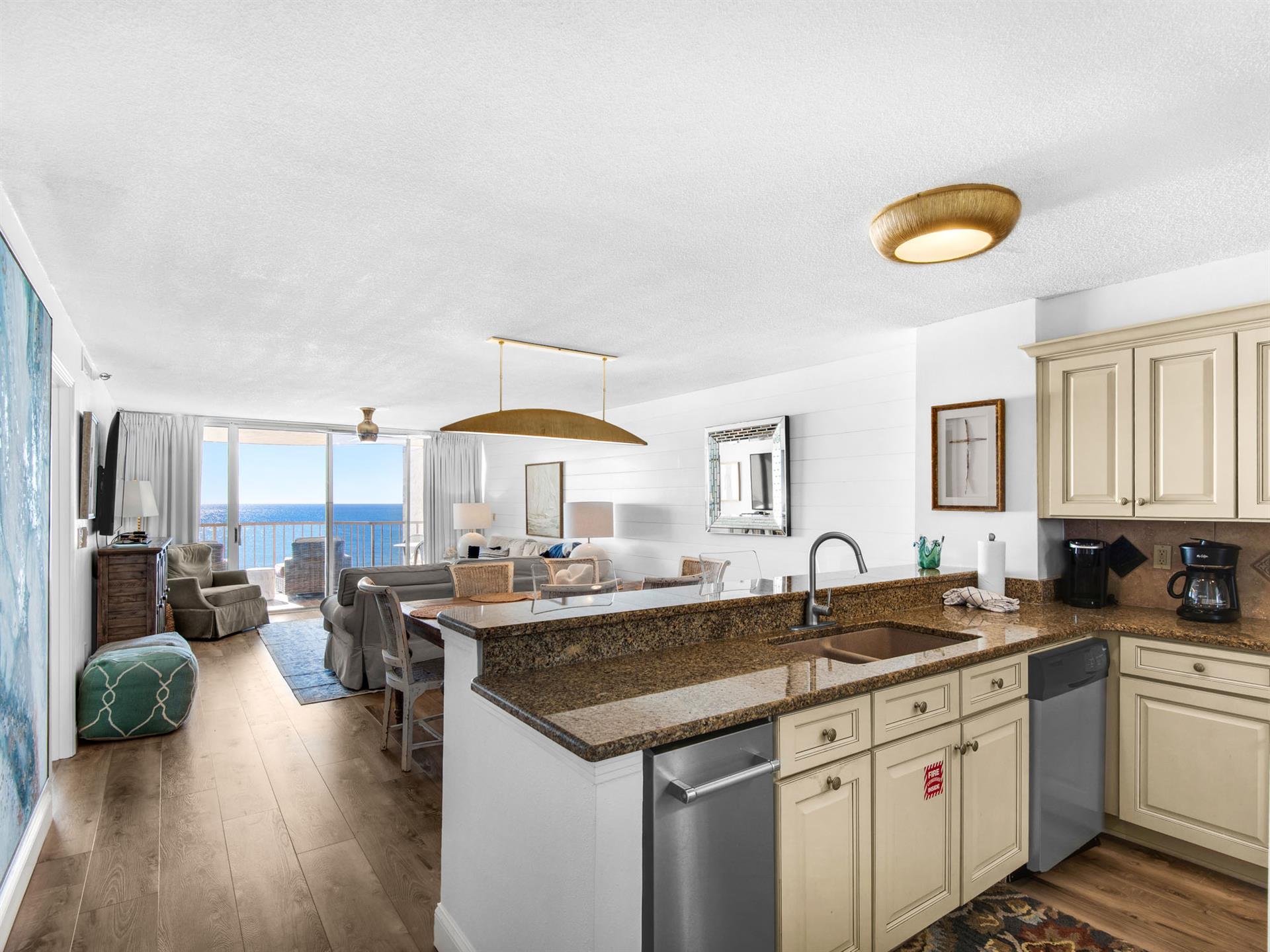 Your openconcept kitchen flows seamlessly into the living space, where granite counters and ocean views create the perfect setting for cooking.