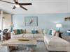 Sink into plush sectional seating in your tranquil living room, where oceaninspired décor and soft coastal colors create your perfect retreat.