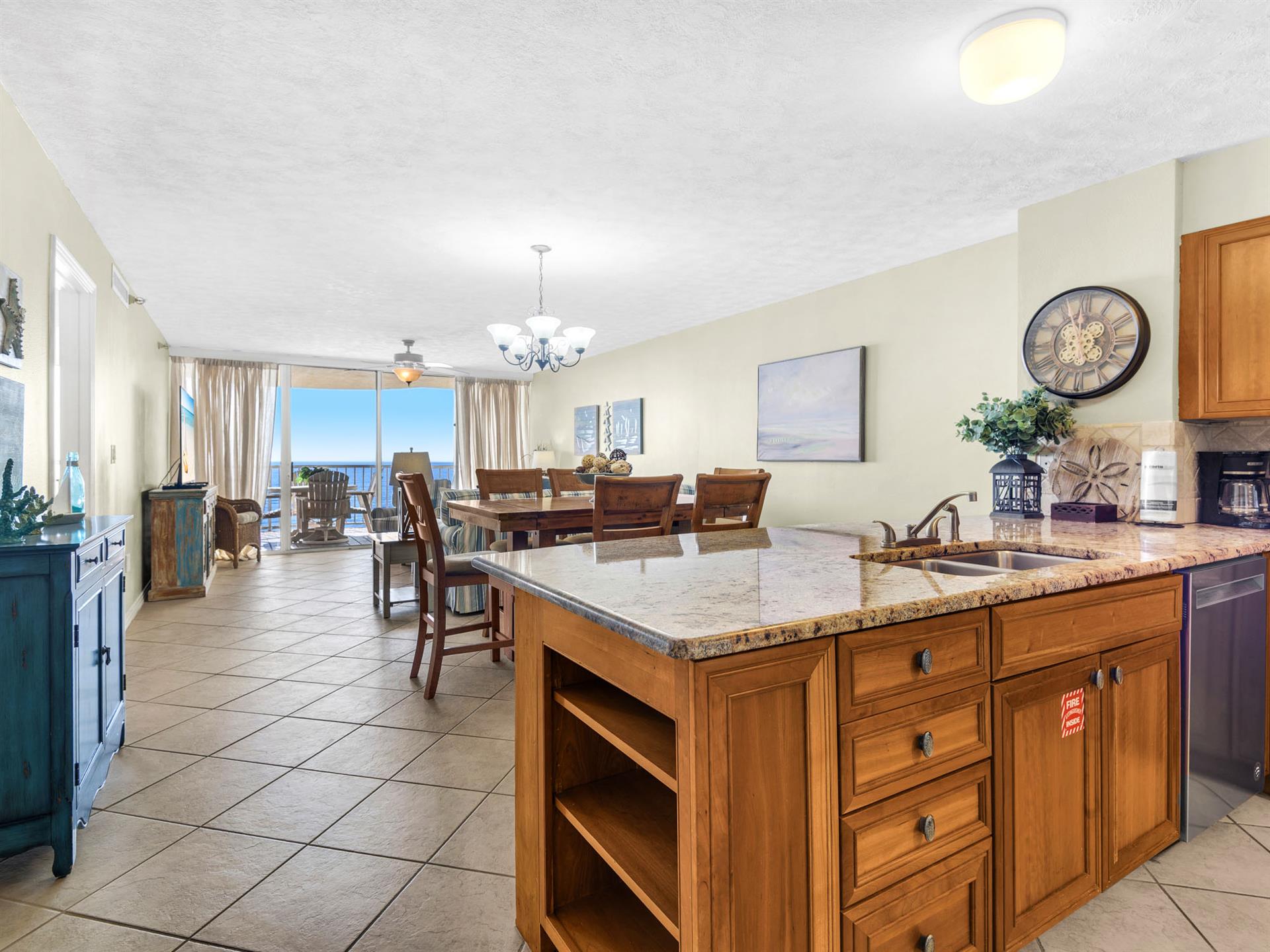 Your spacious kitchen flows seamlessly into the dining area, where granite countertops and rich wood cabinetry create the perfect space for gathering.