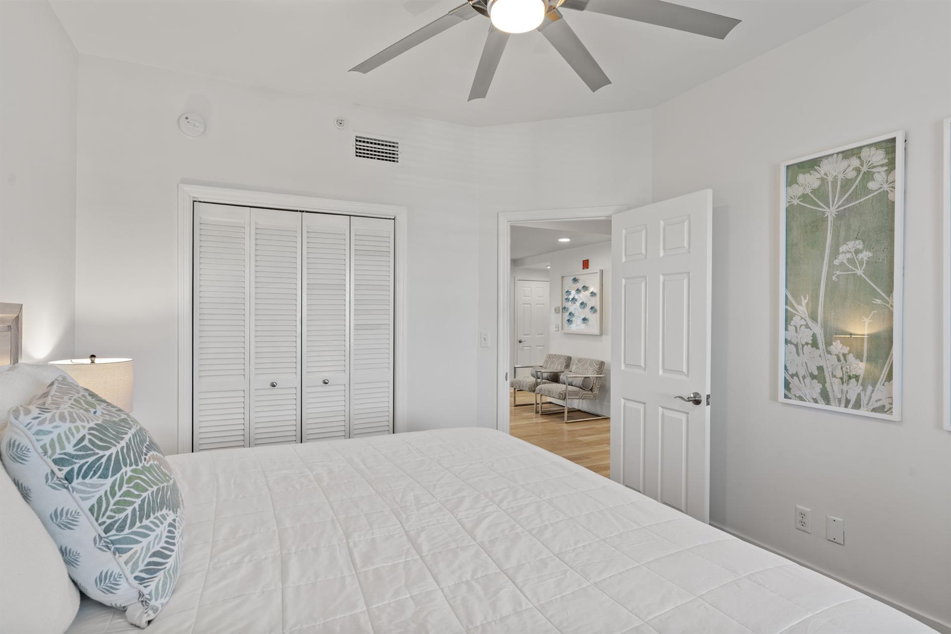 Drift off peacefully in your 1st floor serene king bedroom with tropical accents and gentle ceiling fan keeping you cool all night.