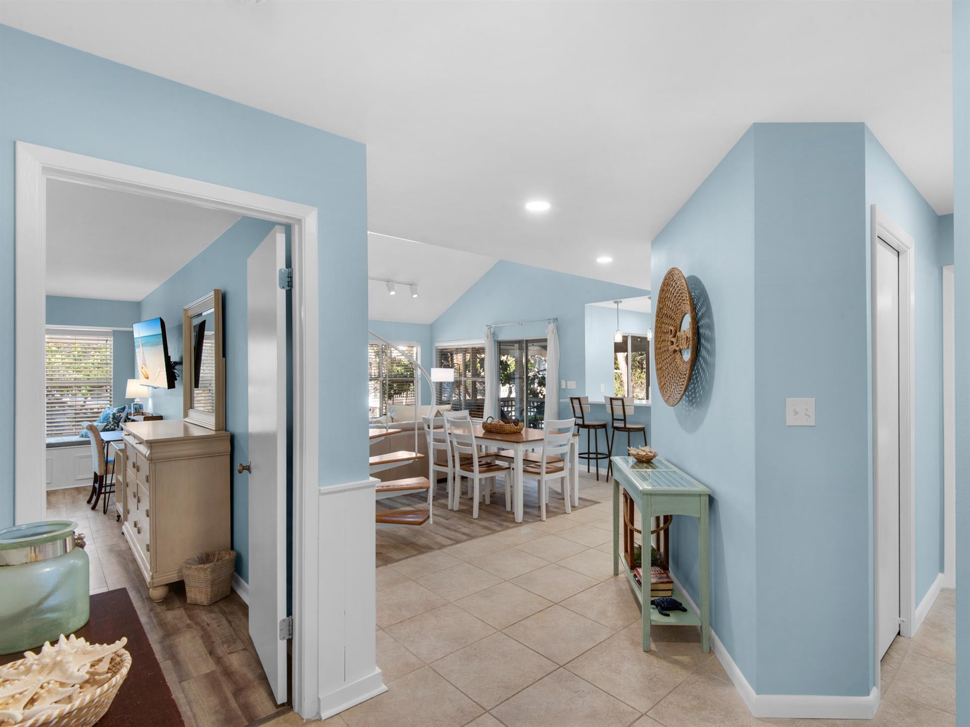 Relax in your coastalinspired retreat with soft blue walls and open living spaces that flow beautifully together.