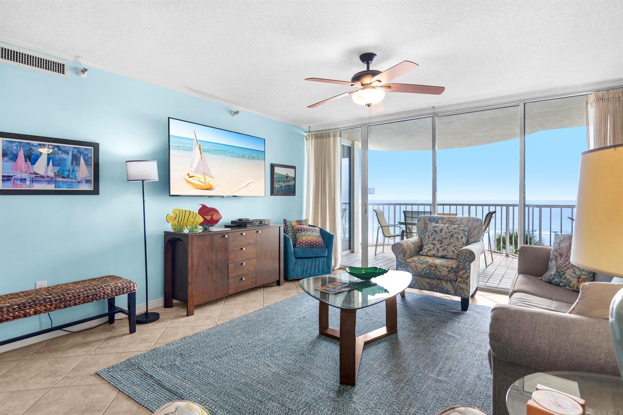 Relax in your coastal living room with stunning ocean views, comfortable seating, and a private balcony where ocean breezes await.
