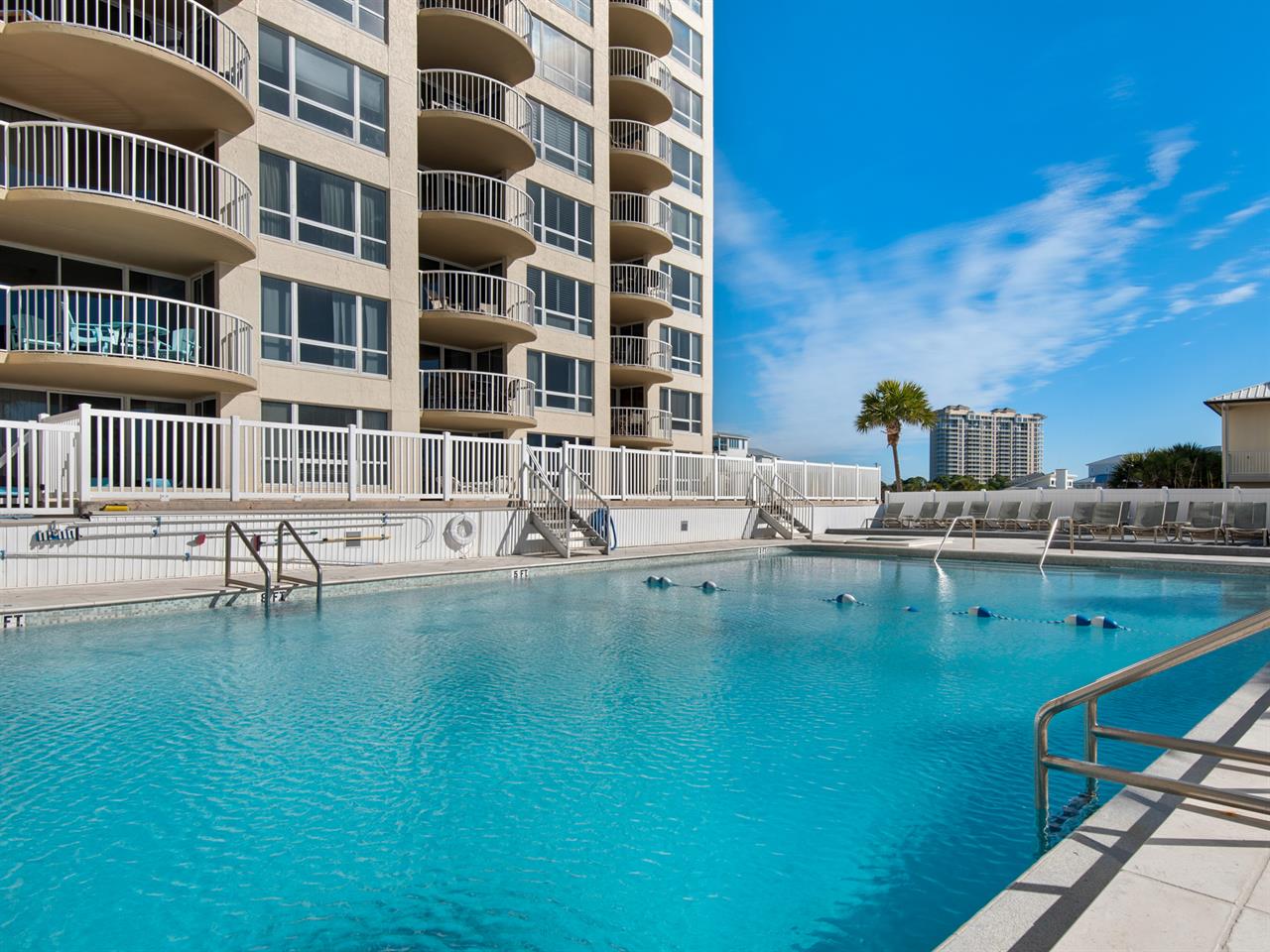 Dive into crystalclear pool waters surrounded by beautiful balconies and sunny Florida skies for your perfect getaway.