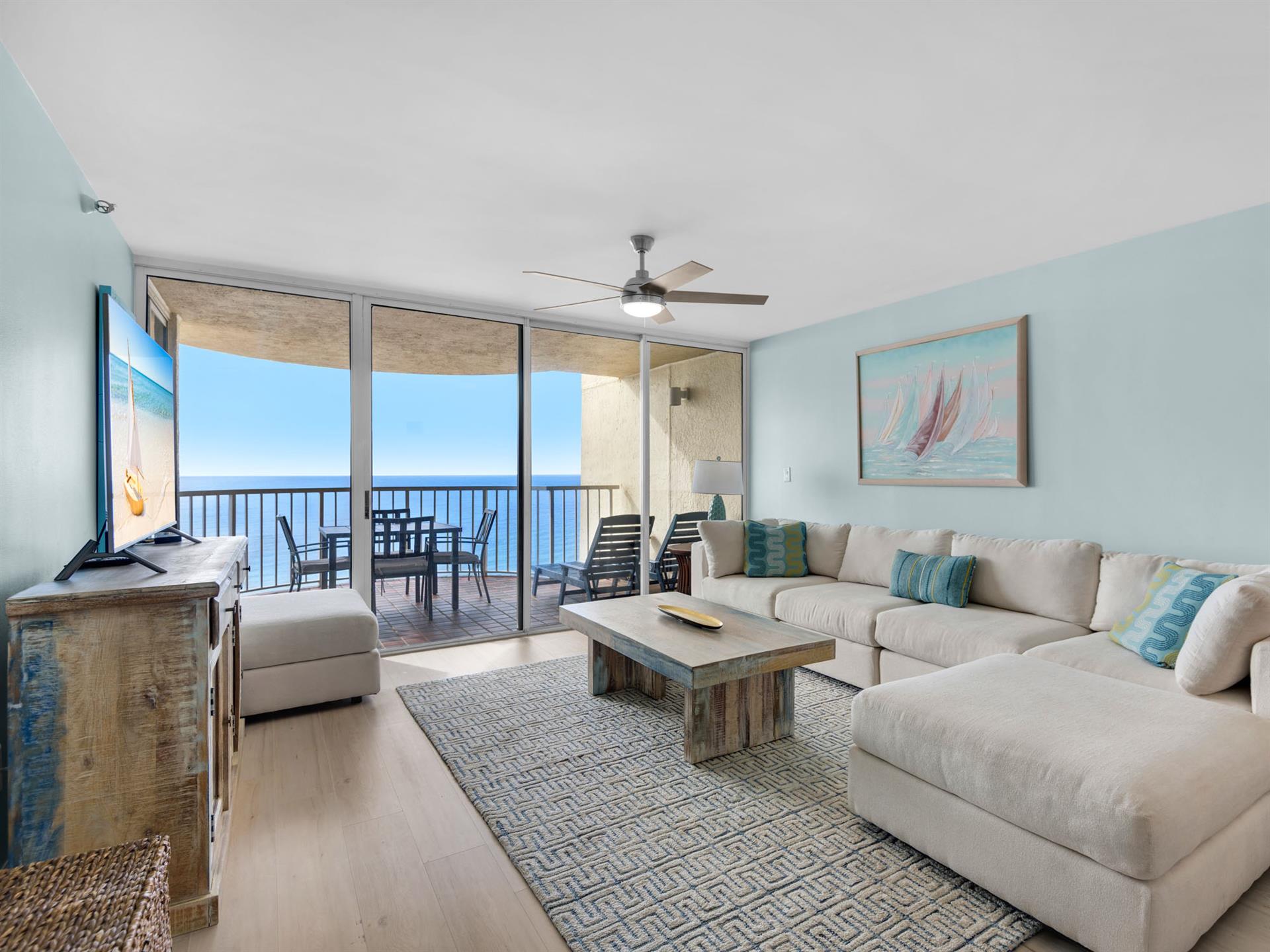 Relax in your coastal living room with plush sectional seating, ocean breeze from your private balcony, and stunning sea views.