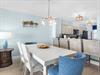 Gather around your stylish dining table where coastal charm meets modern comfort, perfect for memorable meals together.
