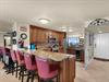 Fully Stocked Kitchen with Bar Seating