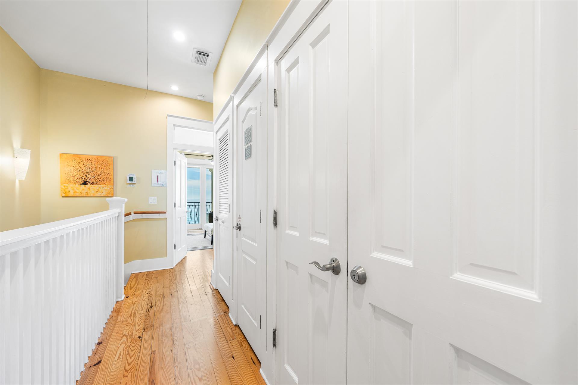 Third Floor Hallway connecting both the Primary King Bedroom and the Queen ensuite bedroom.