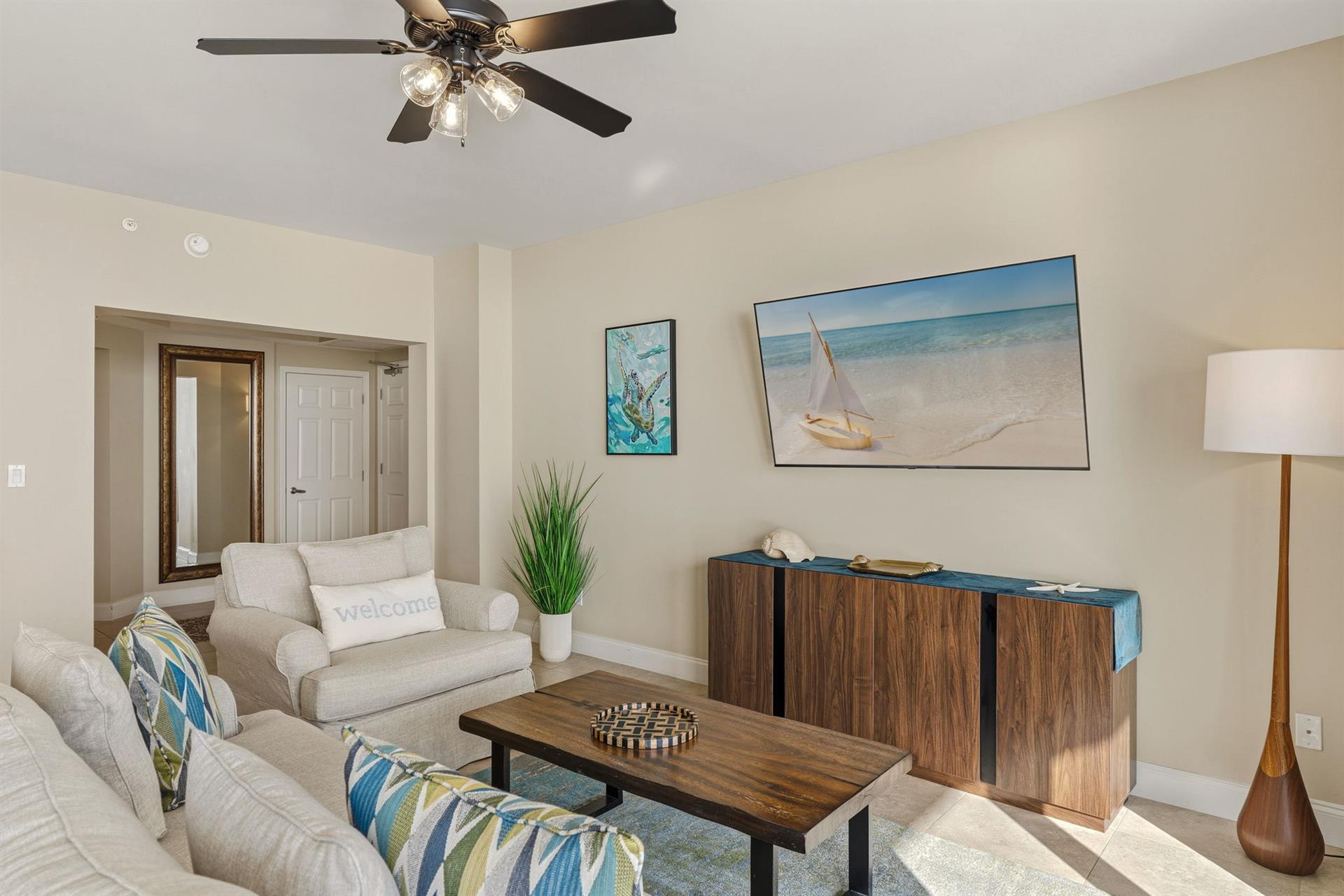 Relax in your bright living room with coastal artwork and comfortable seating that makes you feel right at home.  Plus there is a sleeper sofa for additional guests.