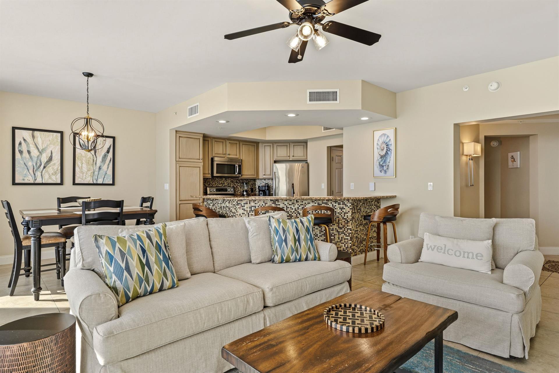 Settle into your openconcept living space where coastal comfort meets modern convenience, complete with full kitchen and dining.