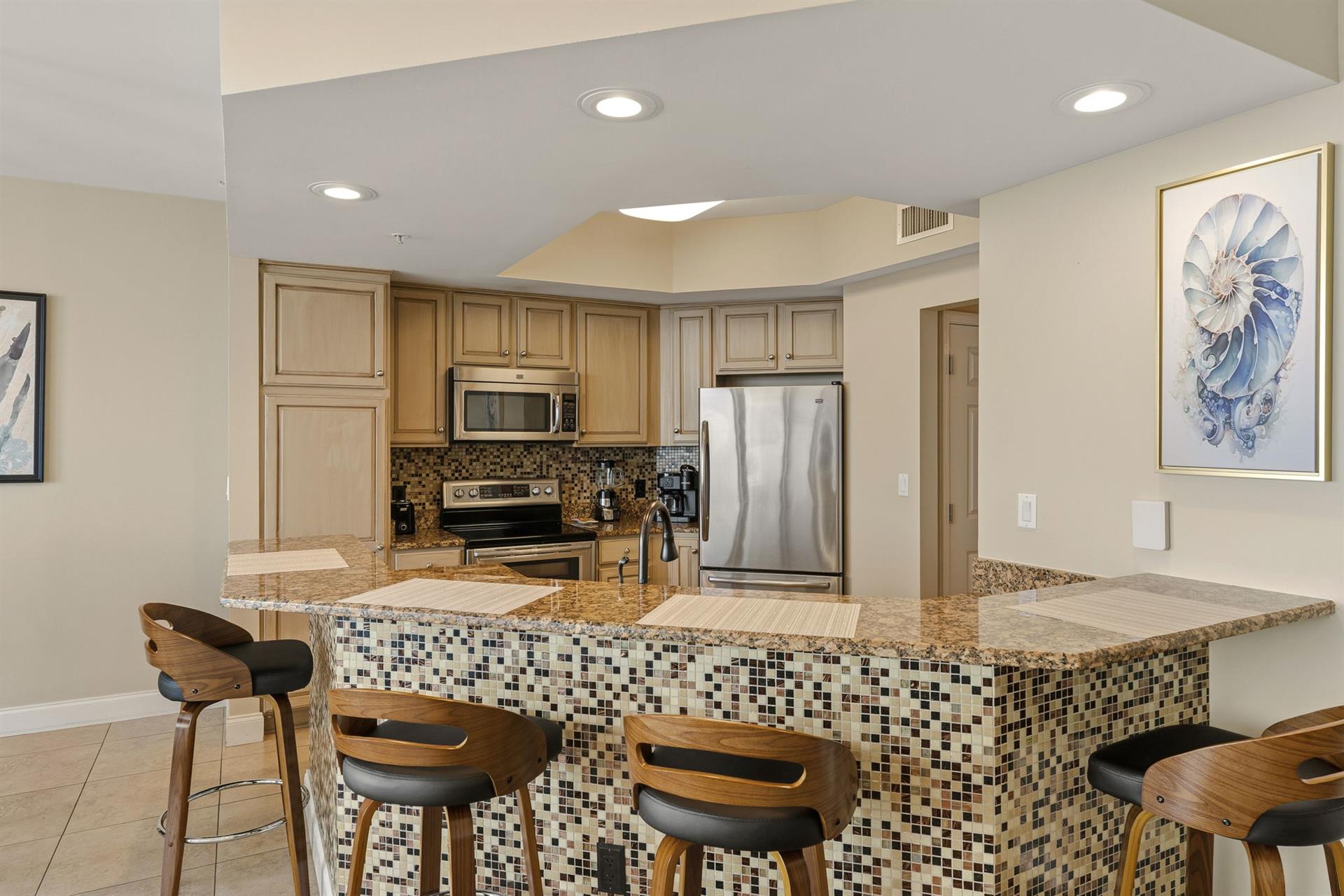 Your fully equipped kitchen features bar seating.
