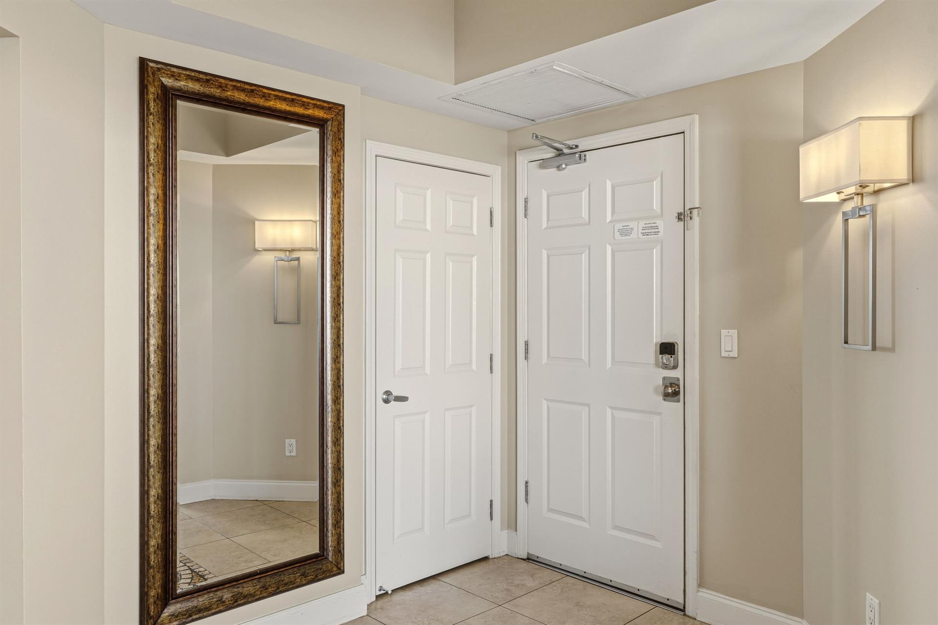Step into your welcoming entryway with elegant lighting and a fulllength mirror perfect for lastminute checks before heading out.