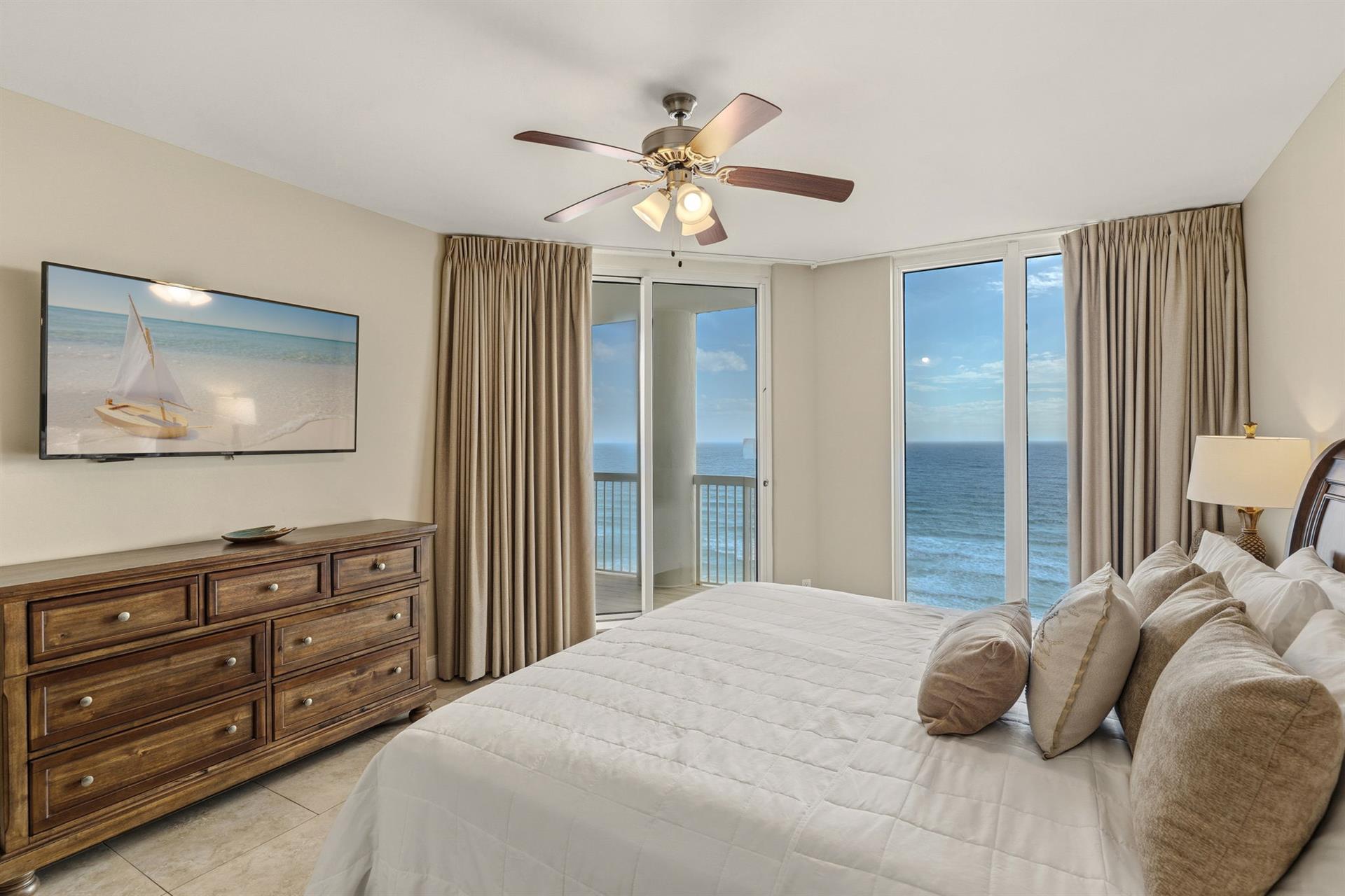 Wake to endless ocean views from your serene bedroom sanctuary, where gentle waves greet you each morning through floortoceiling windows.