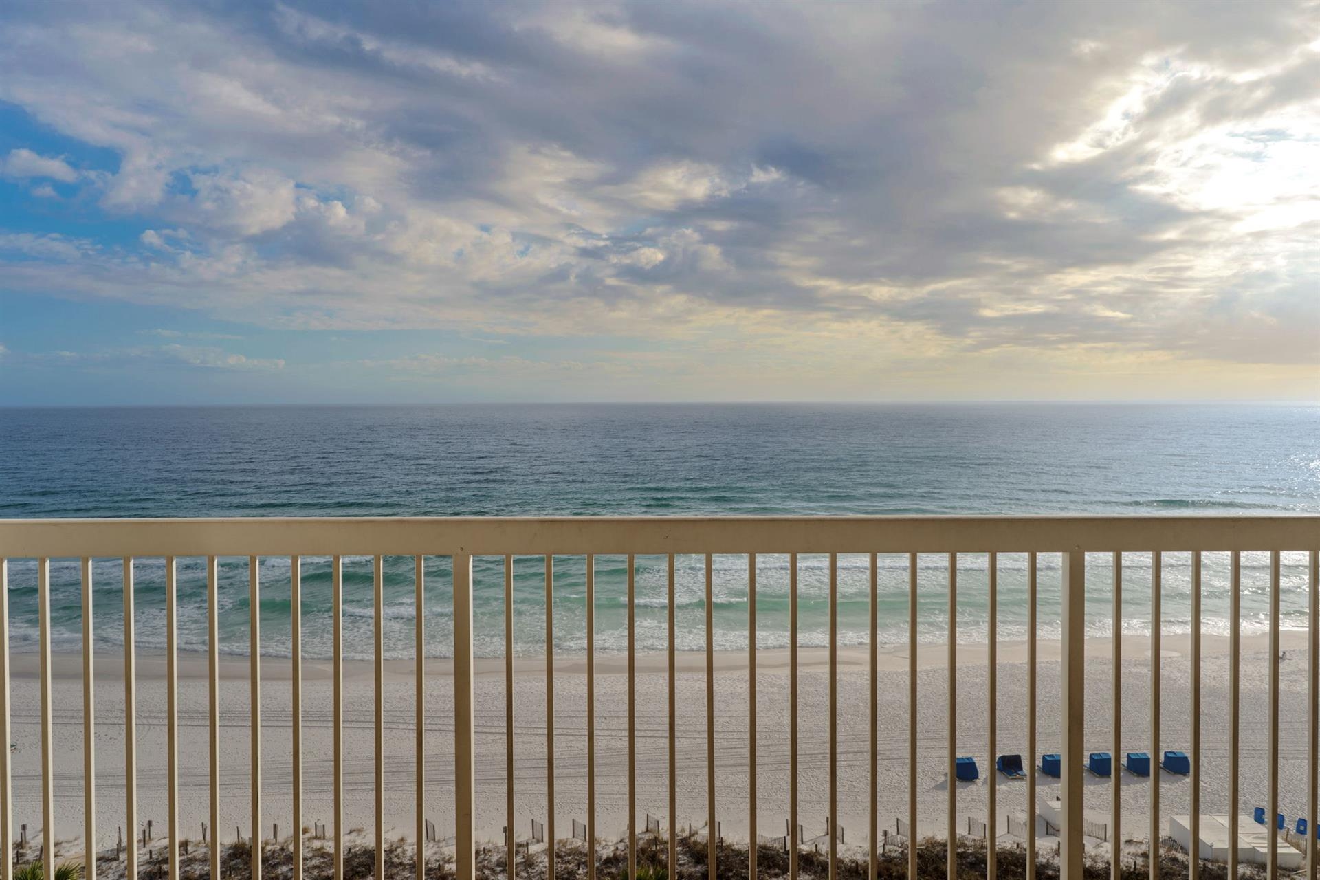 Spectacular beachfront balcony overlooking pristine sandy shores and endless ocean views.