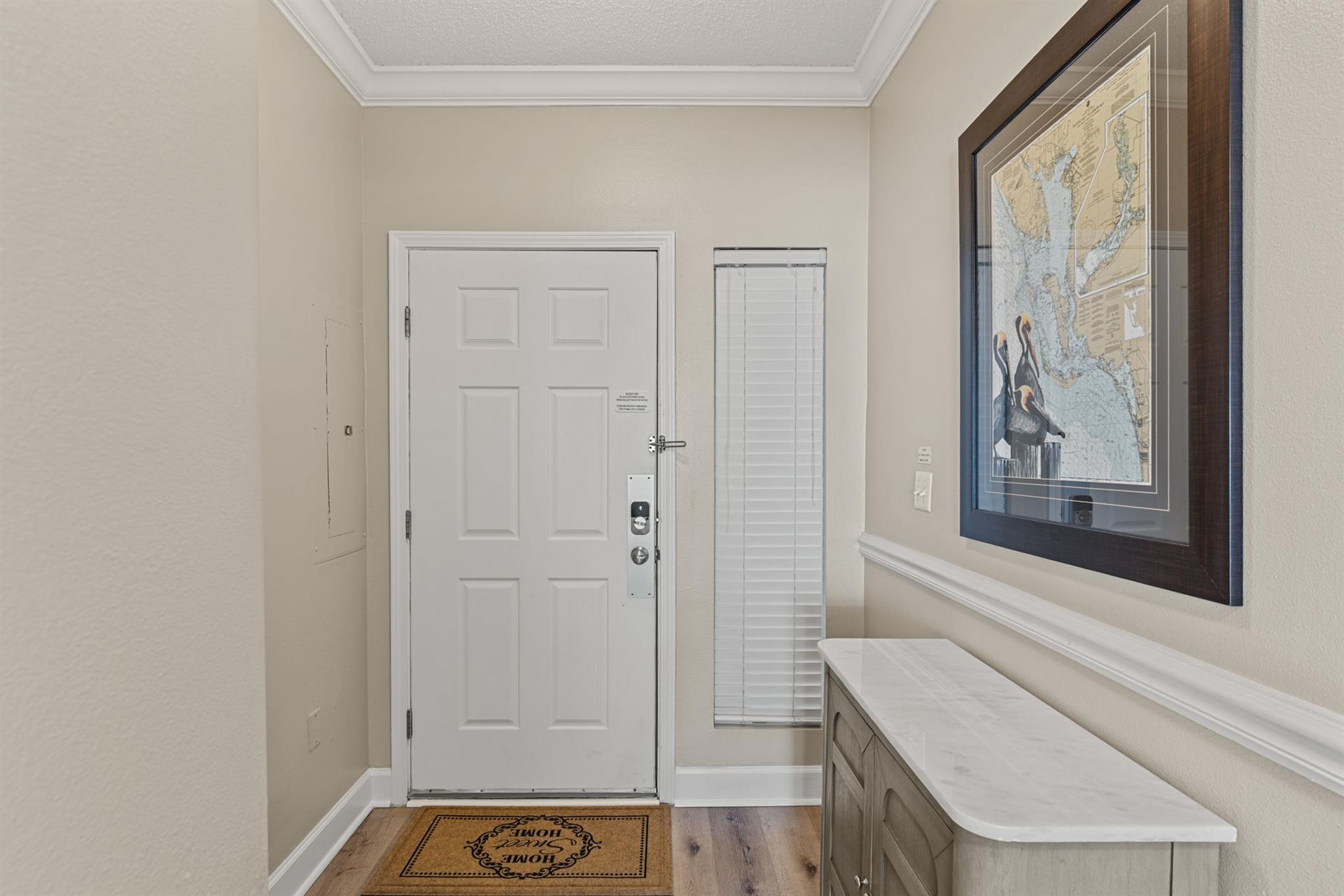 Welcoming entryway with thoughtful coastal touches.