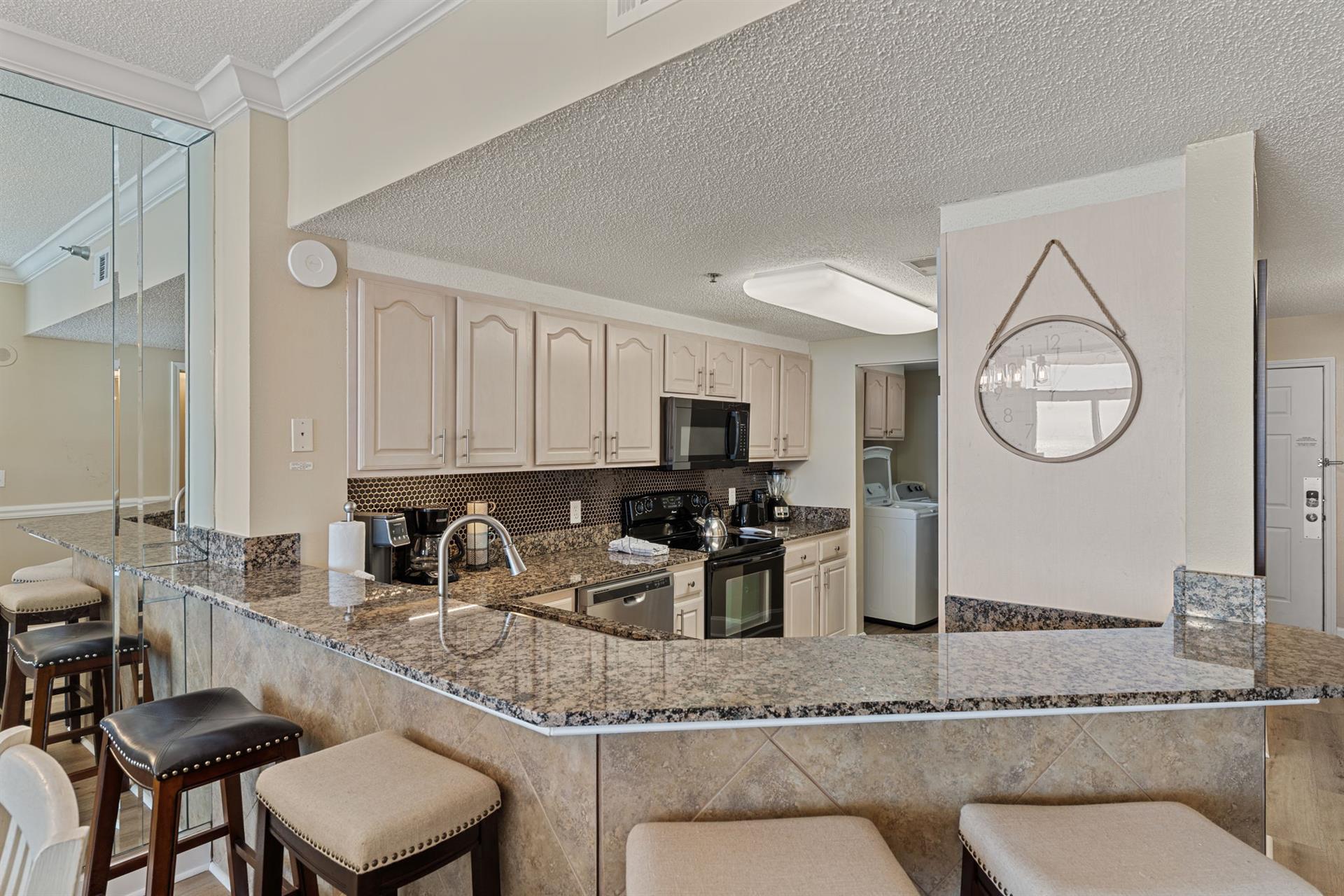 Kitchen with a breakfast bar to enjoy morning coffee and conversations.