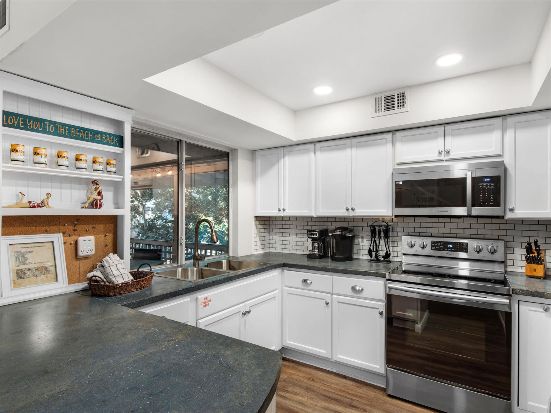 Kitchen with Pass Through Window to Screened Patio