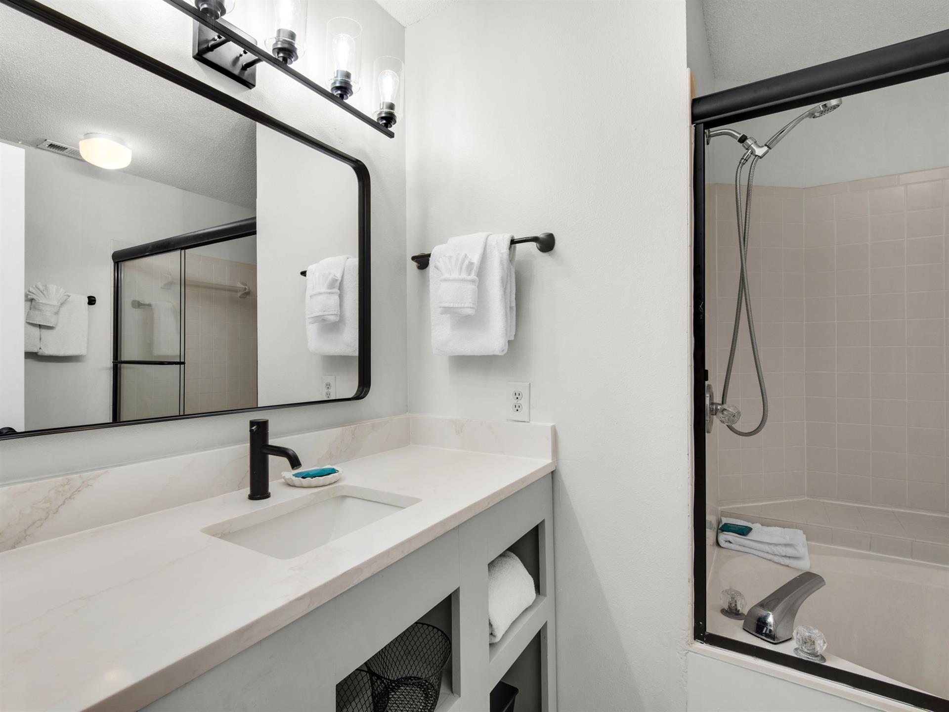 Primary bathroom with tub shower combo