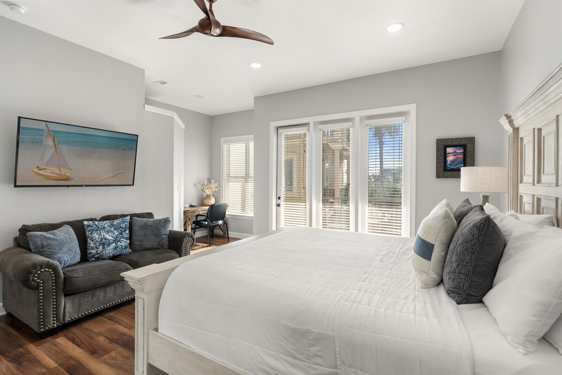 Bedroom 1 with Desk and Access to Private Balcony