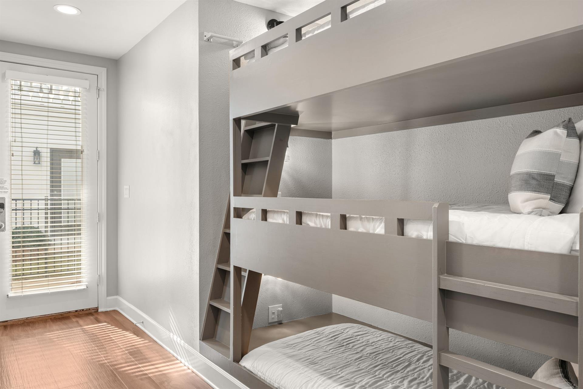 The cozy bunk bed retreat features natural lighting