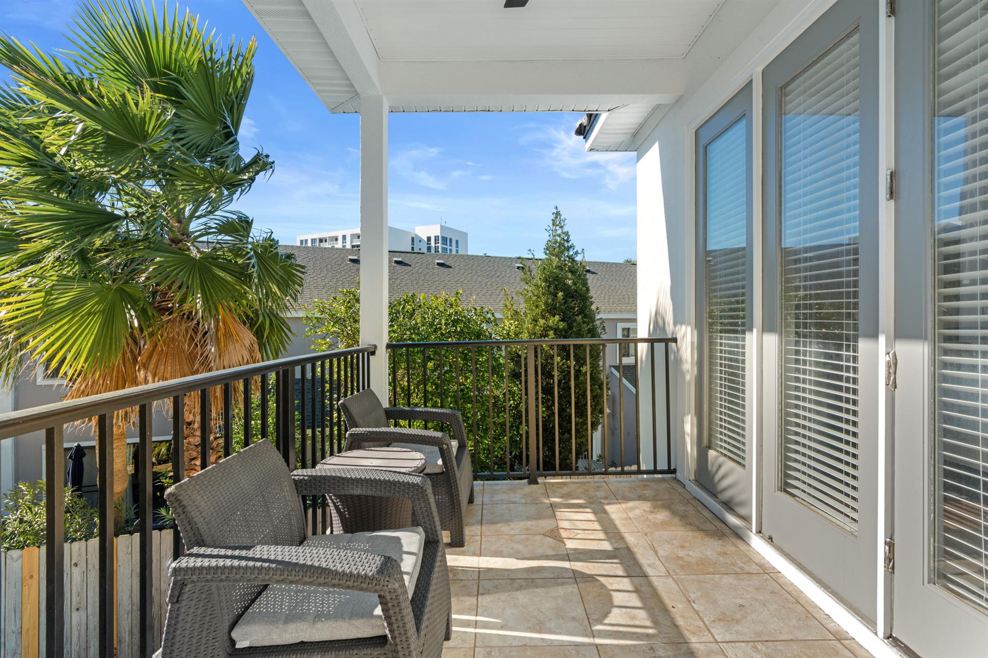 2nd Floor balcony offers the perfect spot to enjoy morning coffee while overlooking lush tropical palms
