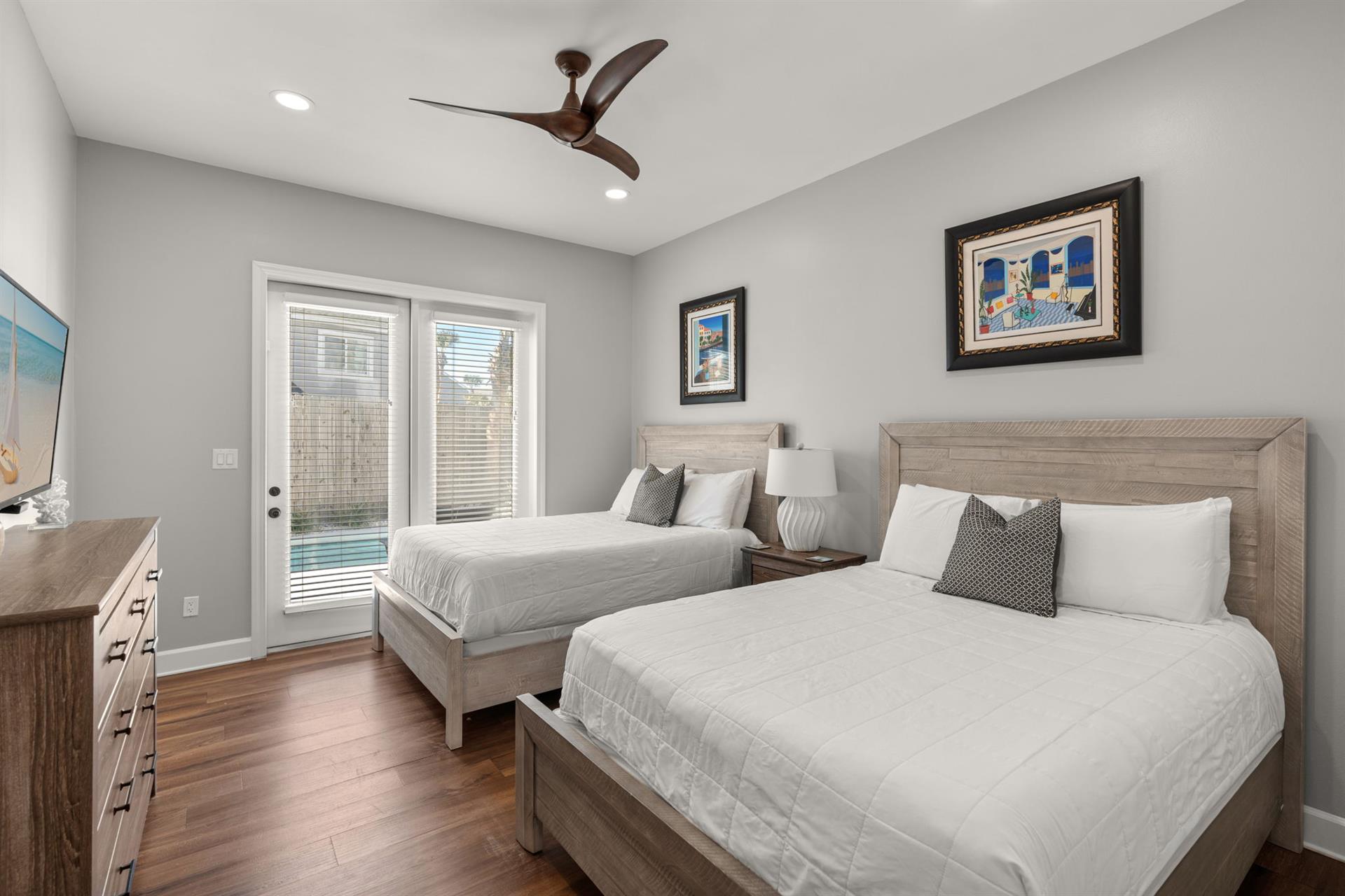 Bedroom 3 on the 1st Floor with 2 Queen Beds and Access to the Private Pool