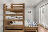 Your kids will love this cozy bedroom with sturdy wooden bunk beds and access to Private Pool and Deck
