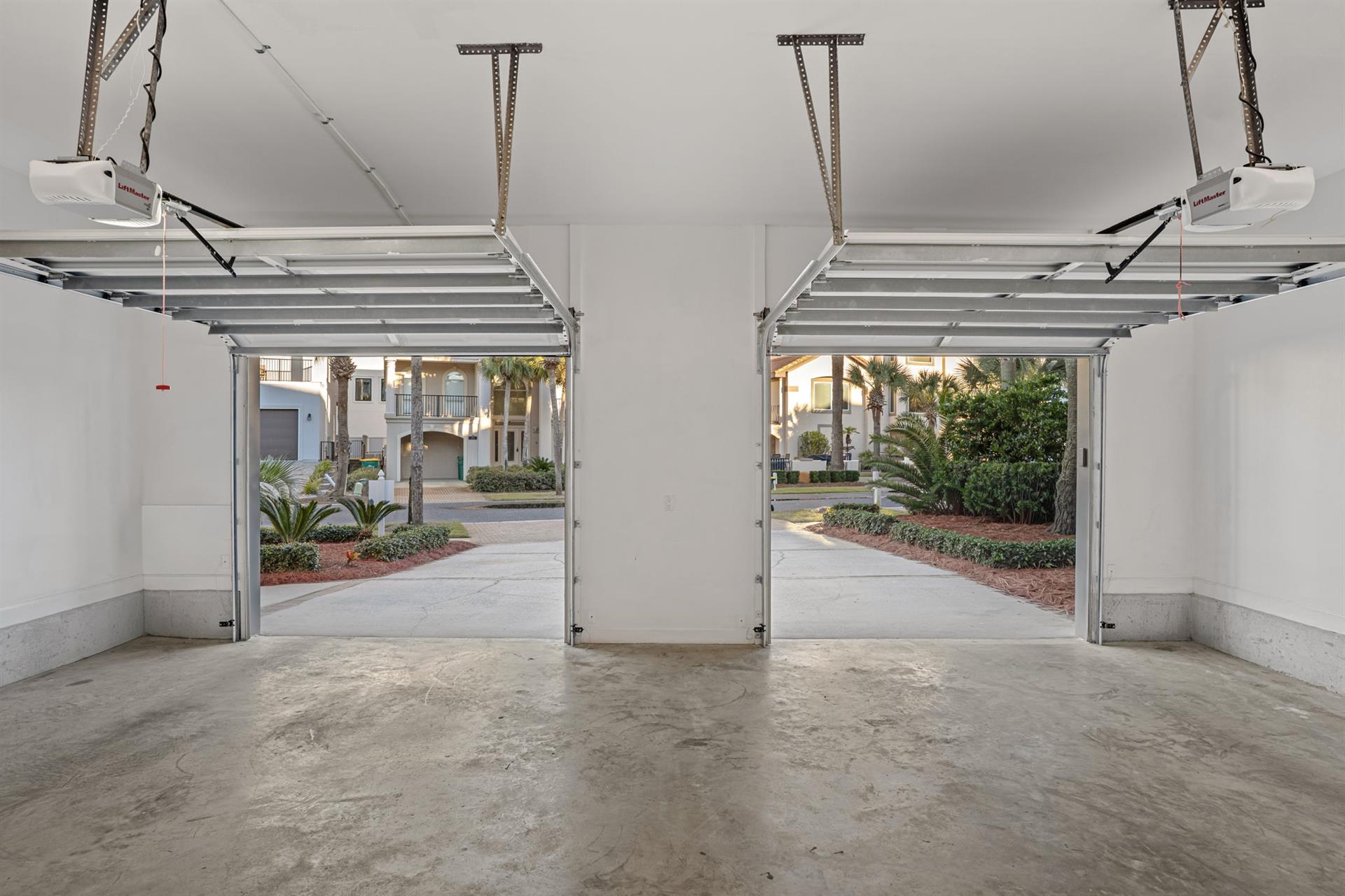 Private twocar garage offers secure parking with convenient automatic doors opening to beautiful landscaped grounds.