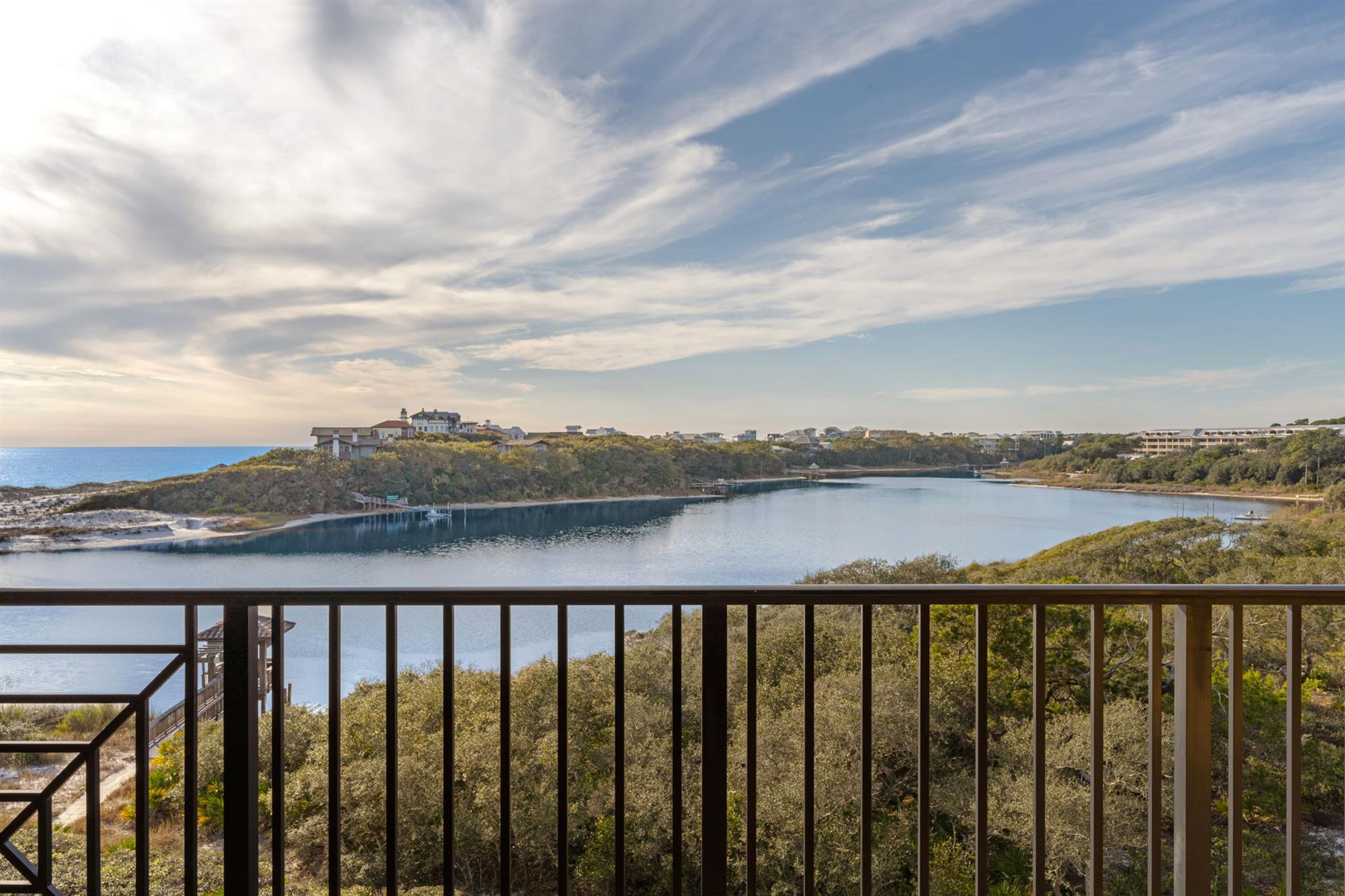 Sweeping lake views framed by natural coastline create a serene backdrop for this elevated gulf and lakeside location.