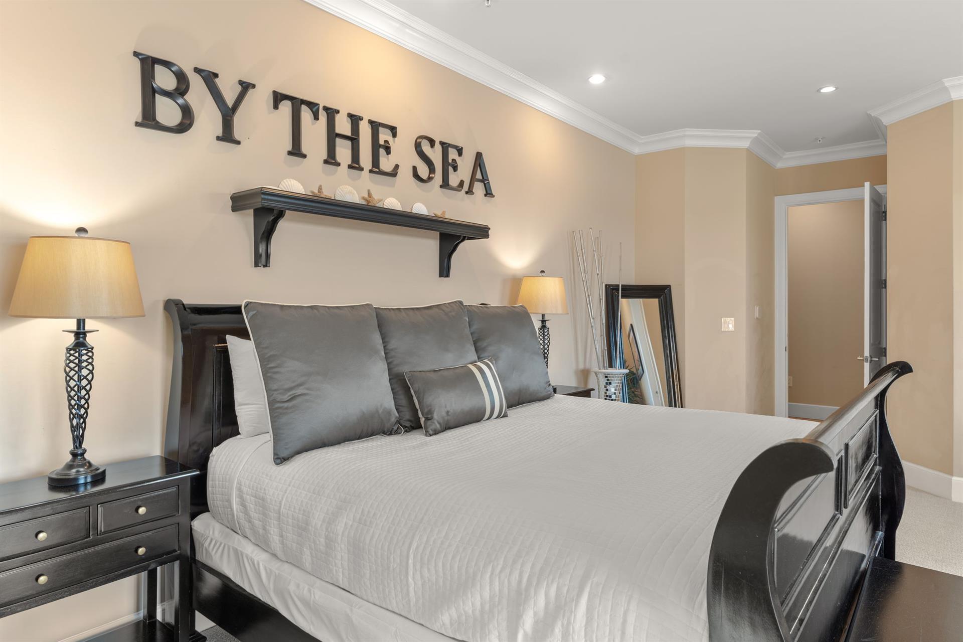 Drift off to sleep in your beautifully appointed coastal bedroom, where elegant furnishings and soothing seainspired decor create the perfect seaside retreat.