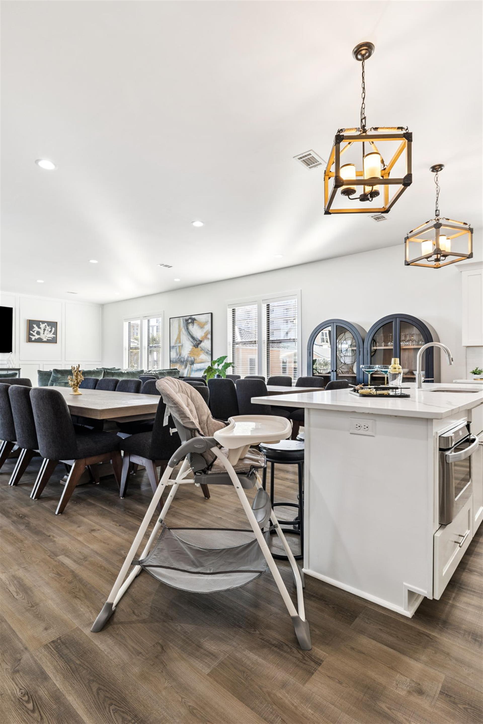Cook meals in the spacious kitchen while little ones sit safely nearby, then gather at the dining table for memorable family moments together.