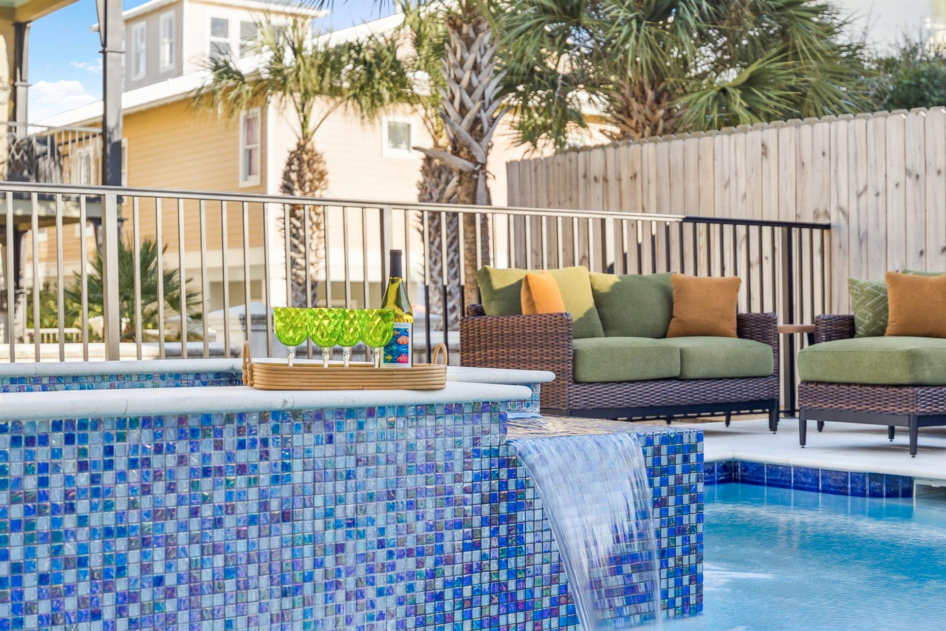 Unwind by your private pool with comfortable seating and tropical palm views creating the perfect outdoor escape.