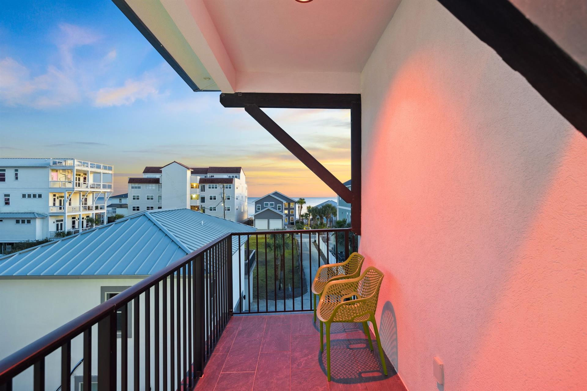Step onto your private balcony and watch the golden sunset paint the sky above the neighborhood rooftops.