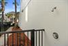 Rinse away beach sand in your private outdoor shower, surrounded by tropical palms and coastal breezes.