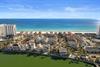 Stunning beachfront community featuring luxury homes along pristine white sand beaches and emerald waters.
