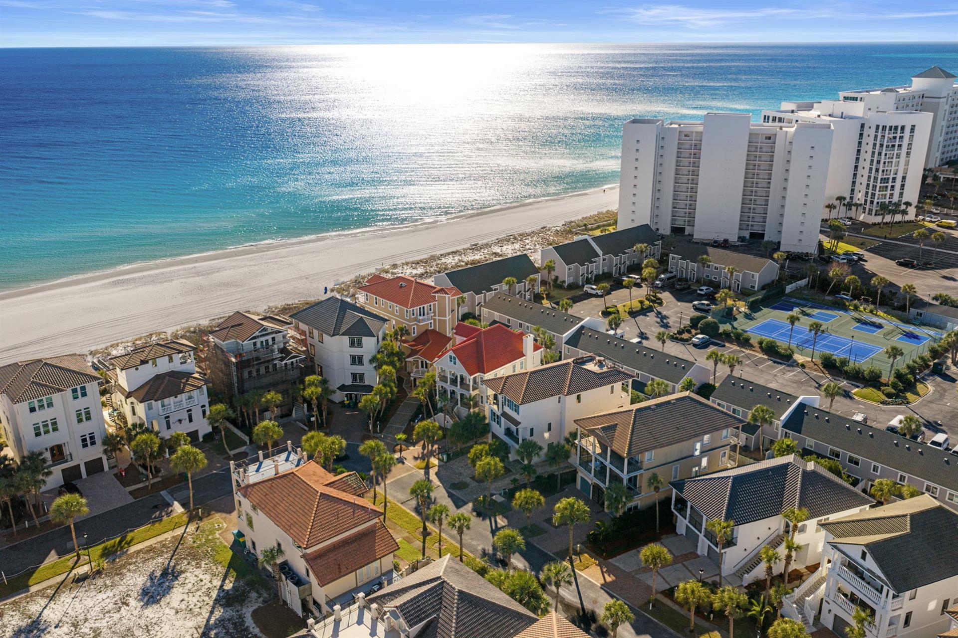 Stunning beachfront location with pristine white sand and crystalclear waters just steps from these coastal vacation homes.