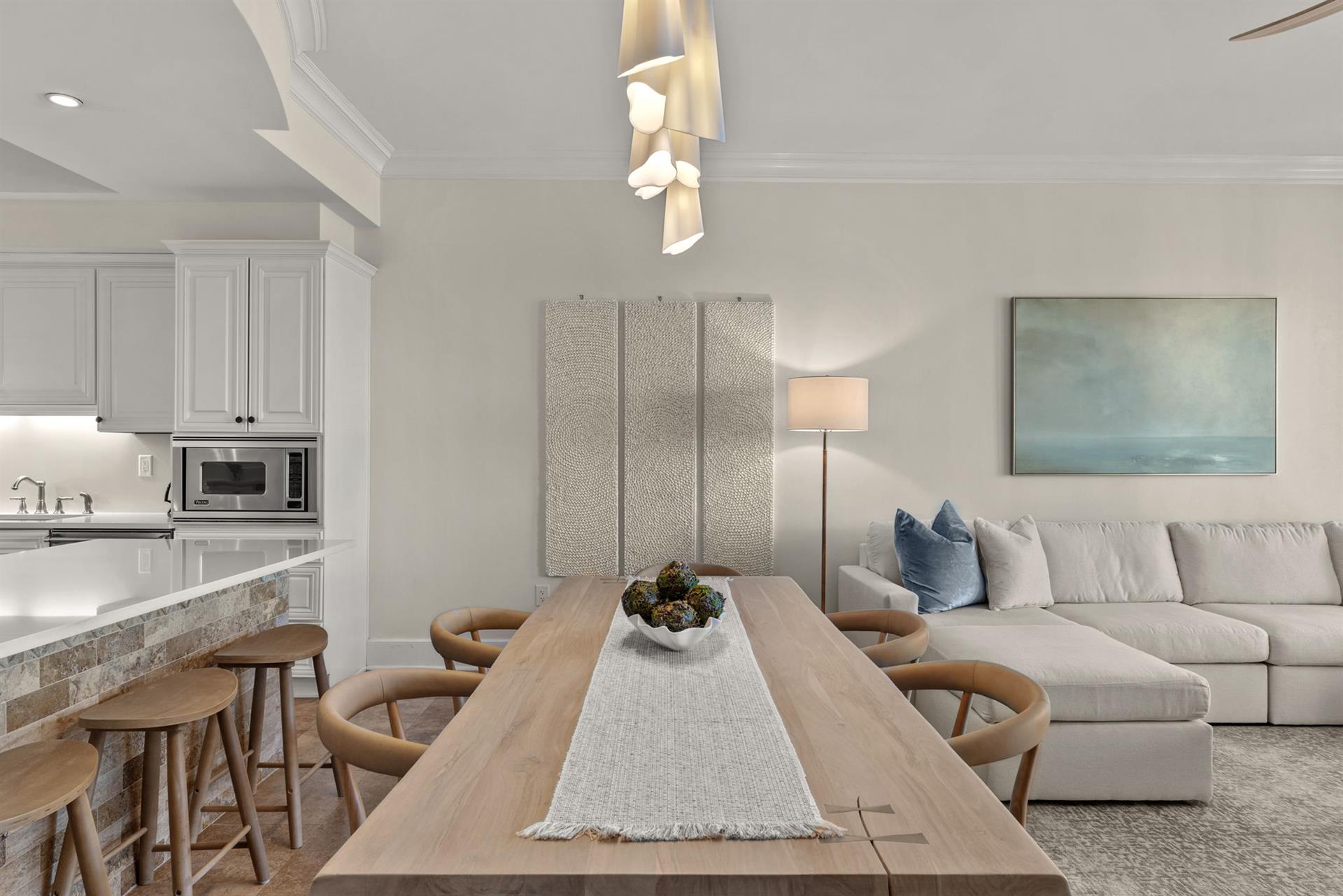 Settle into your openconcept haven where modern coastal style meets comfort. Gather around the dining table or sink into plush seating.