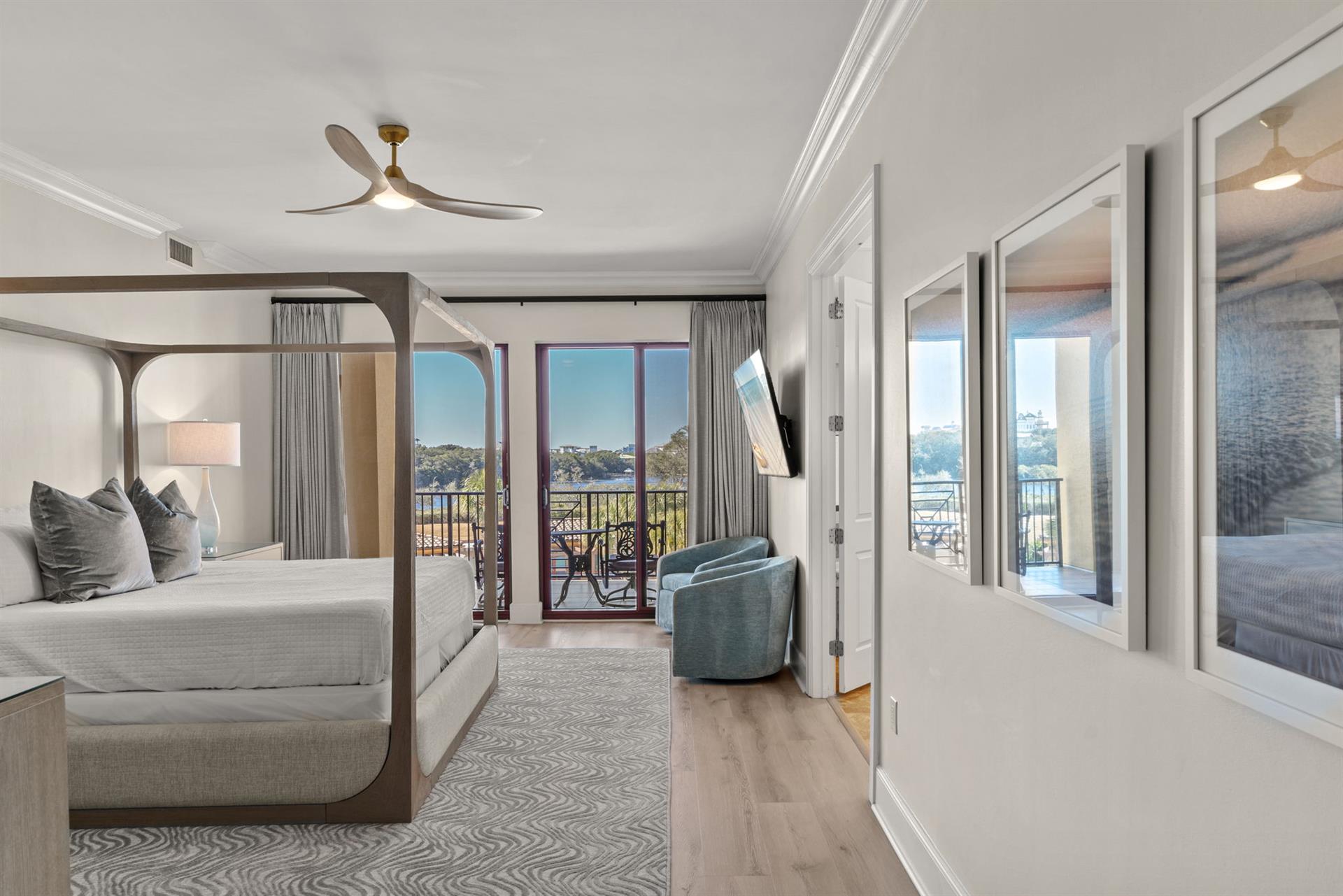 Your elegant bedroom features a fourposter bed and private balcony with stunning views, creating the perfect retreat for relaxation.