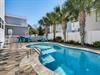 Dive into your private oasis with this sparkling pool surrounded by swaying palms and turquoise loungers for perfect poolside relaxation.