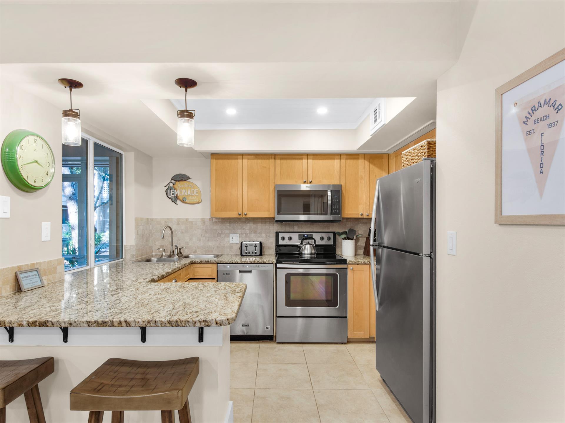 Your fully equipped kitchen invites culinary adventures with granite countertops, stainless steel appliances, and a cozy breakfast bar for morning coffee.