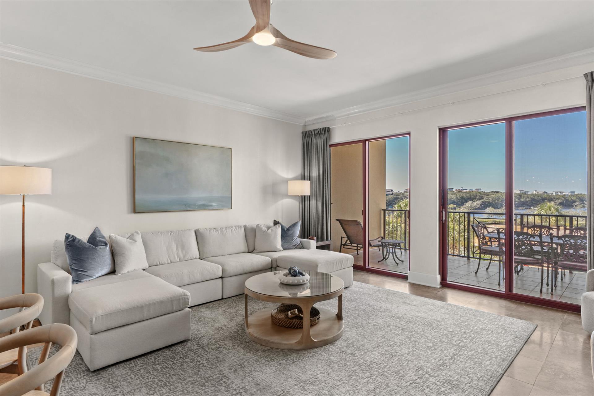 Unwind in your stylish living room with plush seating and natural light streaming through floortoceiling windows.