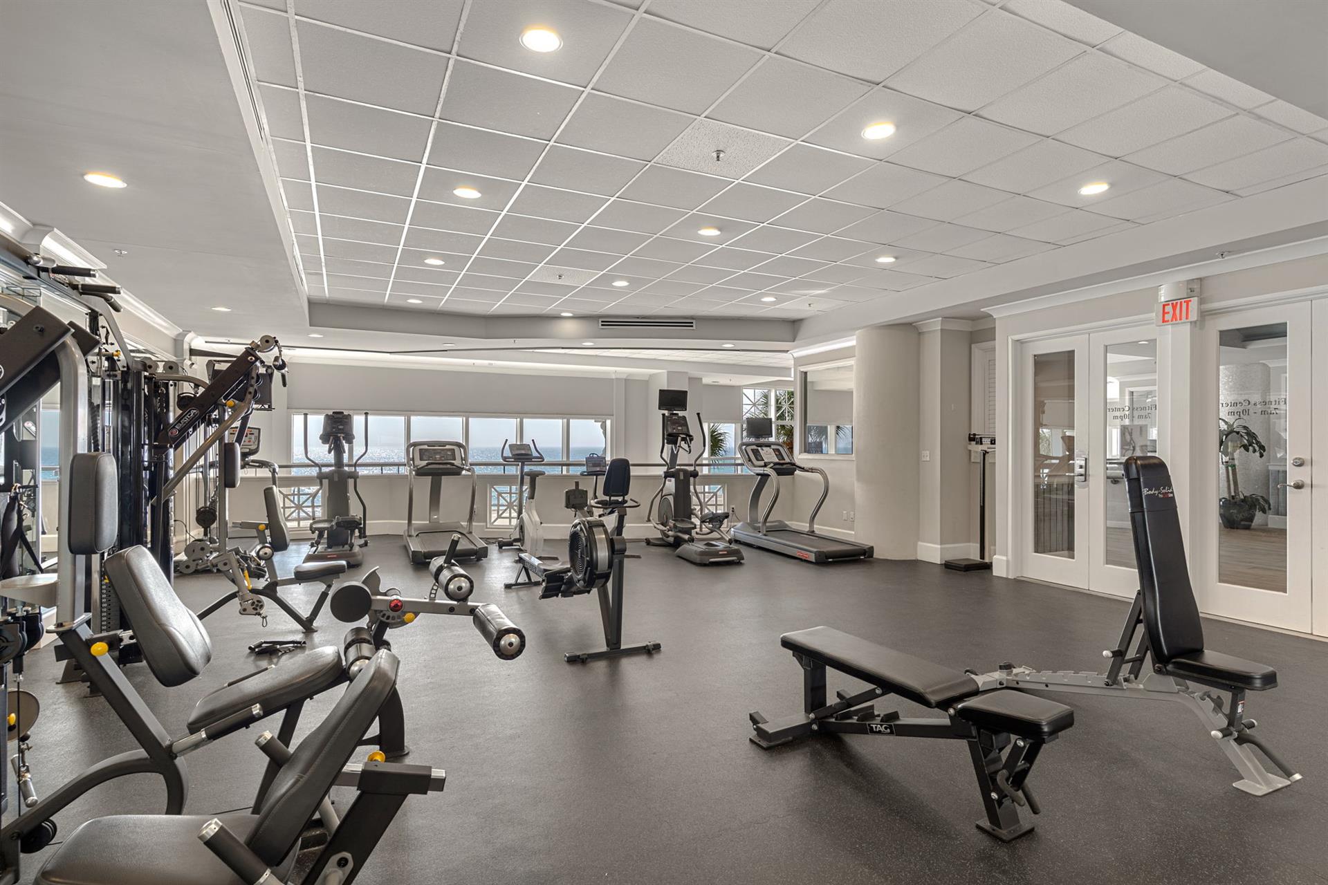Maintain your fitness routine in this fully equipped gym featuring modern cardio and strength training equipment.