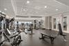 Maintain your fitness routine in this fully equipped gym featuring modern cardio and strength training equipment.