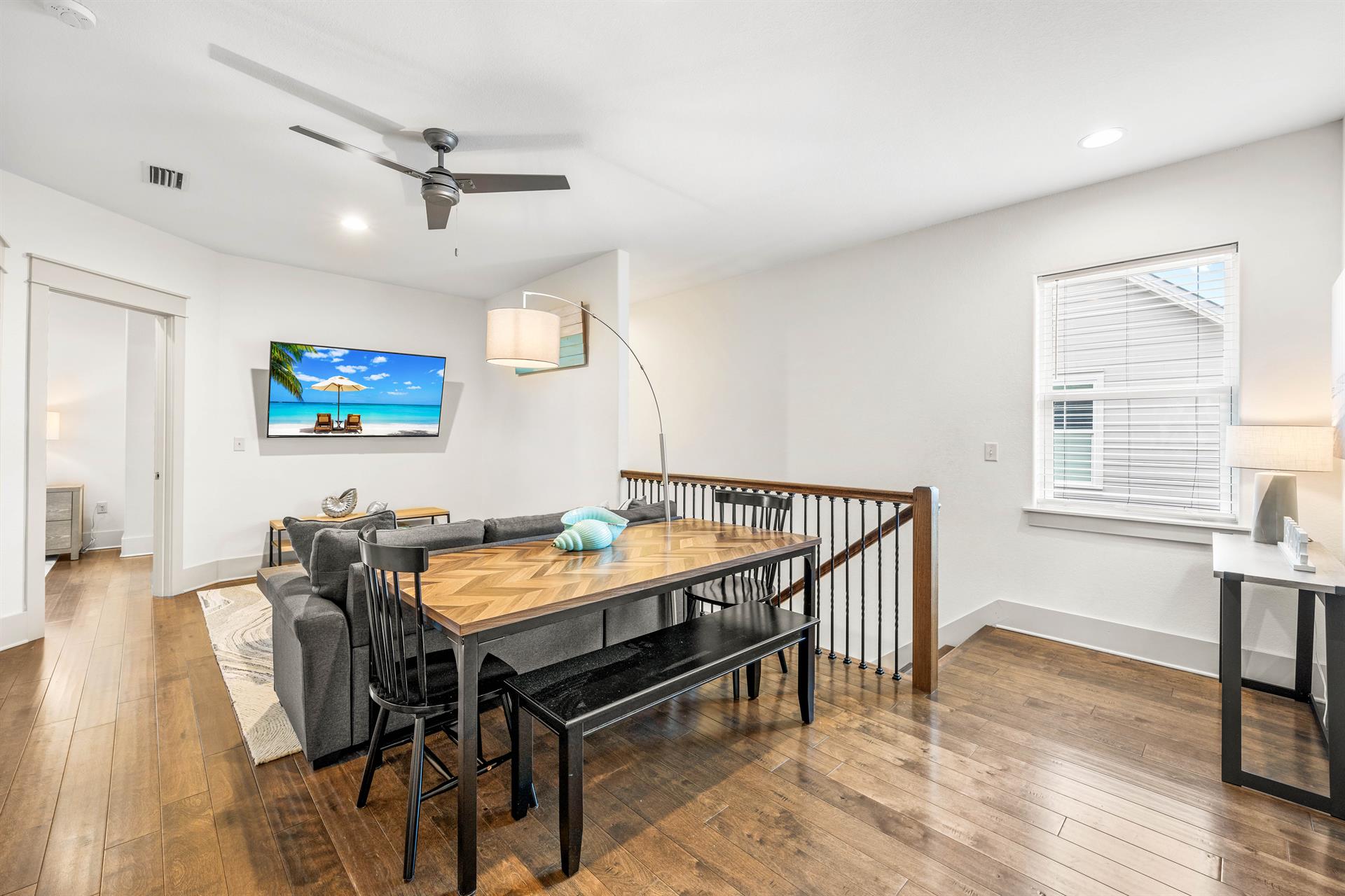 2nd floor bonus living area with kids in mind  Table for 6 perfect for games or puzzles.  Sofa  65 Smart TV with Cable Also