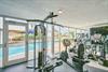 Stay motivated in the fully equipped fitness center with inspiring pool views to energize your workout routine.