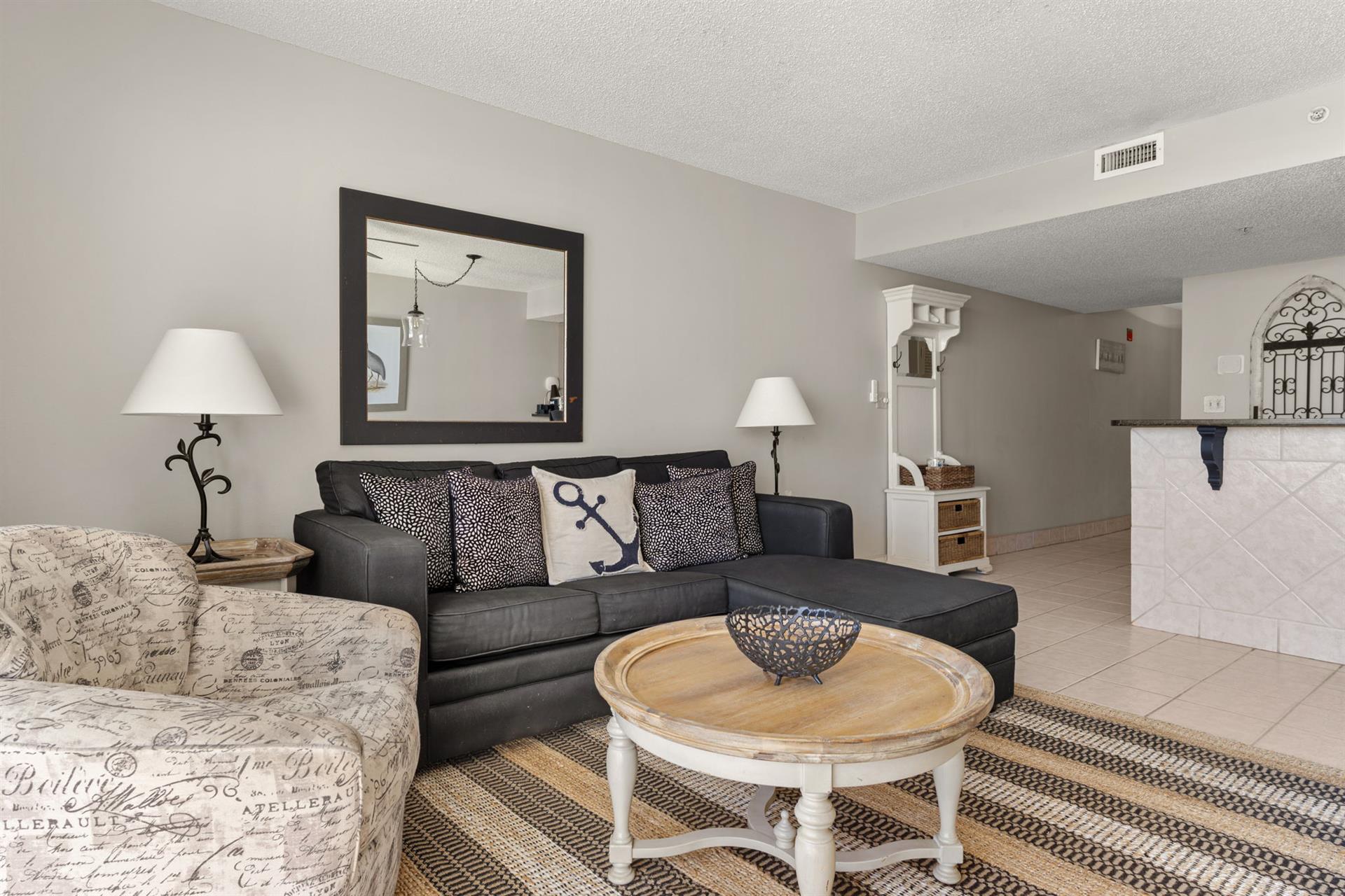 Relax on the sectional with charming nautical touches that create the perfect coastal retreat atmosphere.