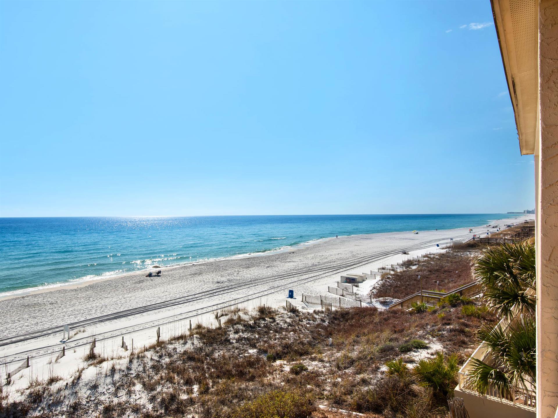 Stunning beachfront views stretch endlessly from this elevated vantage point, showcasing pristine white sand and crystalclear waters.