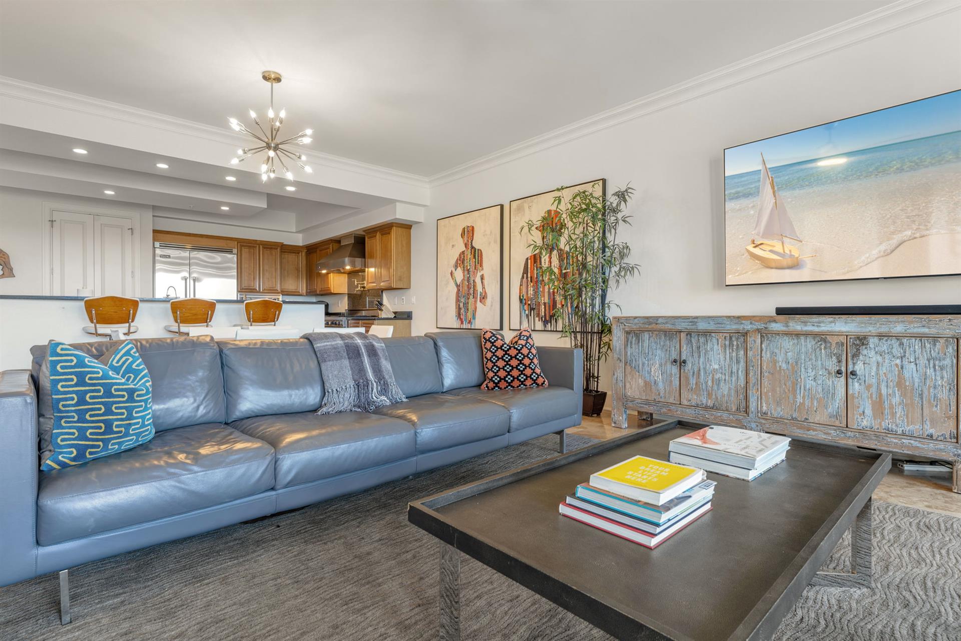 Sink into the plush leather sofa and let coastal artwork transport you to paradise while you plan your adventures.