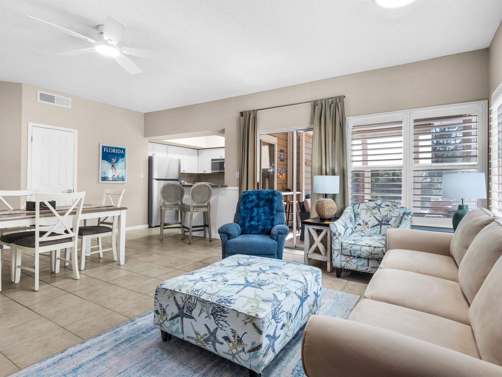 Unwind in your spacious living area where coastal blues meet comfort—perfect for relaxing after beach days.